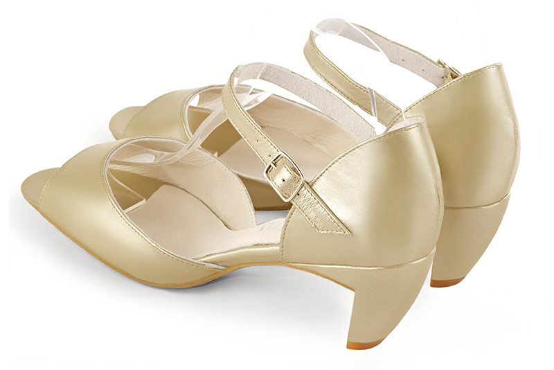 Gold women's closed back sandals, with an instep strap. Round toe. Medium comma heels. Rear view - Florence KOOIJMAN